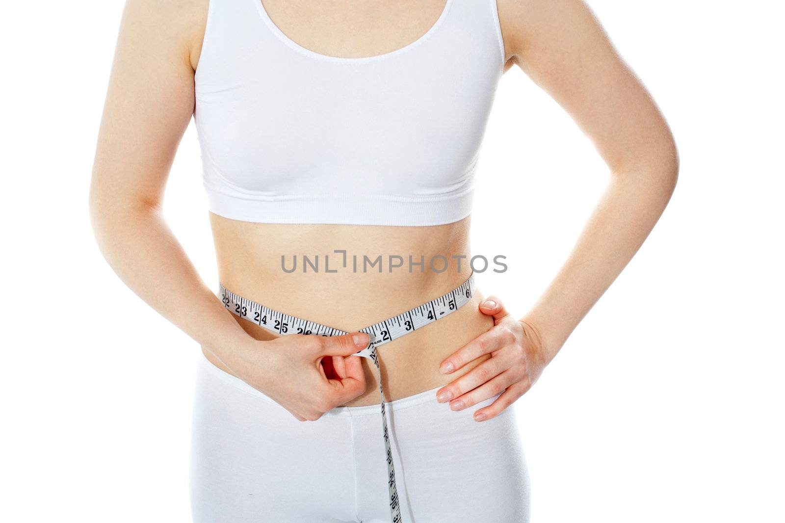 Woman measuring perfect shape by stockyimages