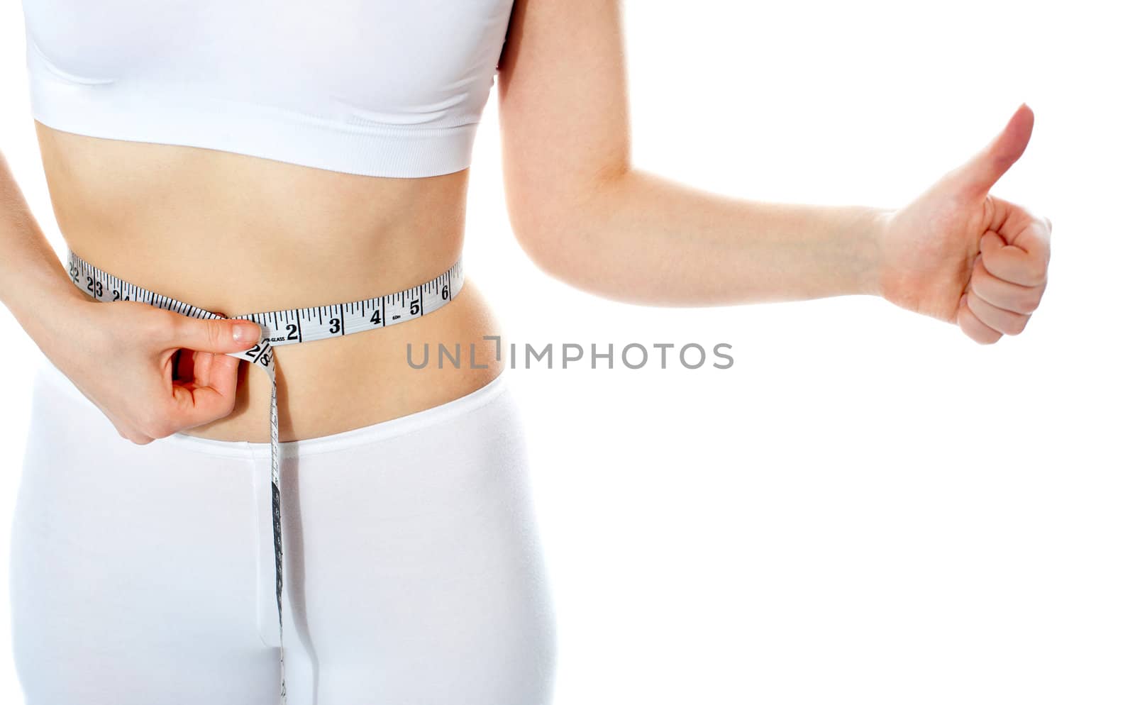 Closeup of tape measure around woman waist. Isolated. Thumbs-up gesture