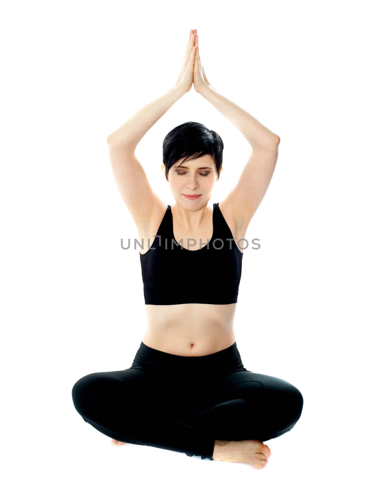 Beautiful blonde girl meditating in black. Doing yoga, lotus pose