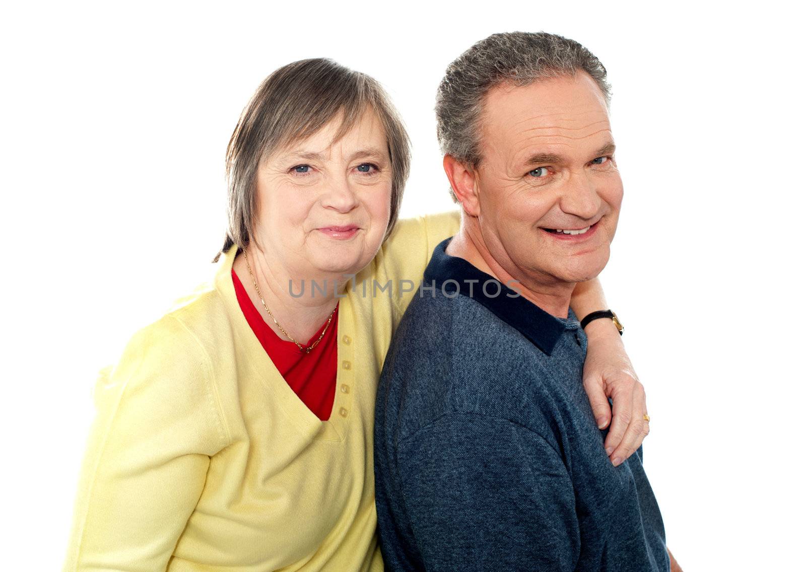 Closeup portrait of loving elderly couple. Wife hugging husband from behind