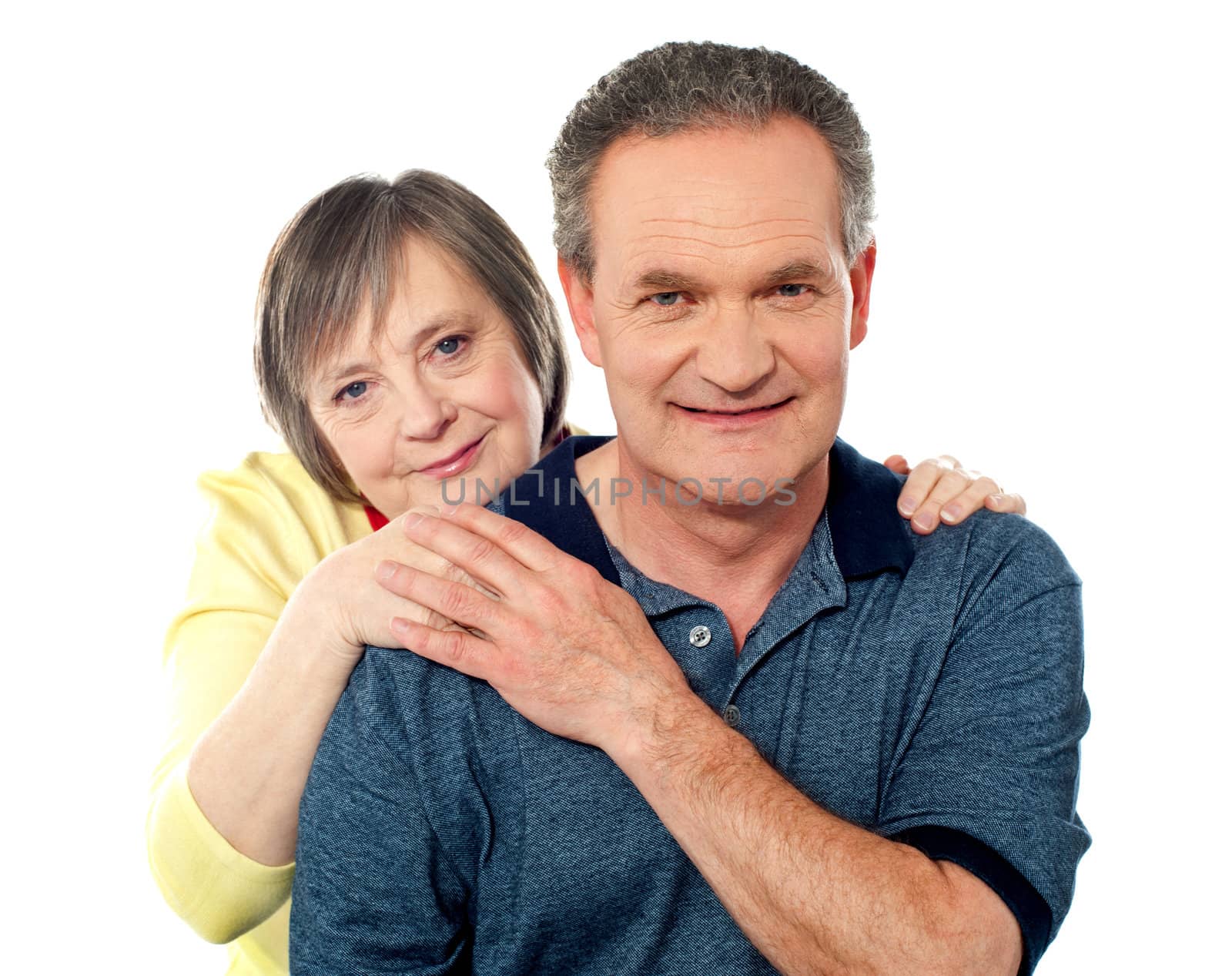 Attractive senior couple being playful over white background
