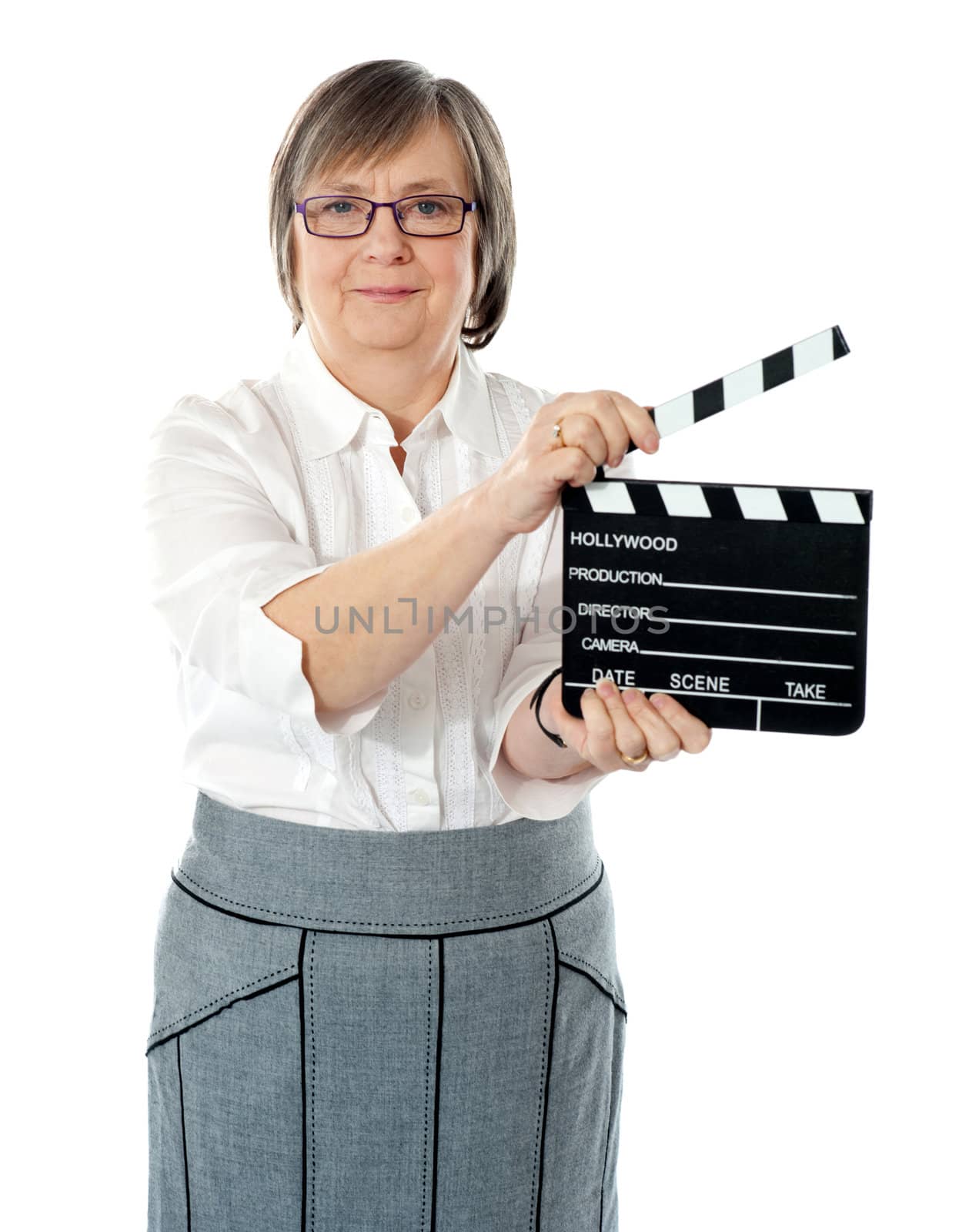 Attractive senior woman using clapperboard. All on white background