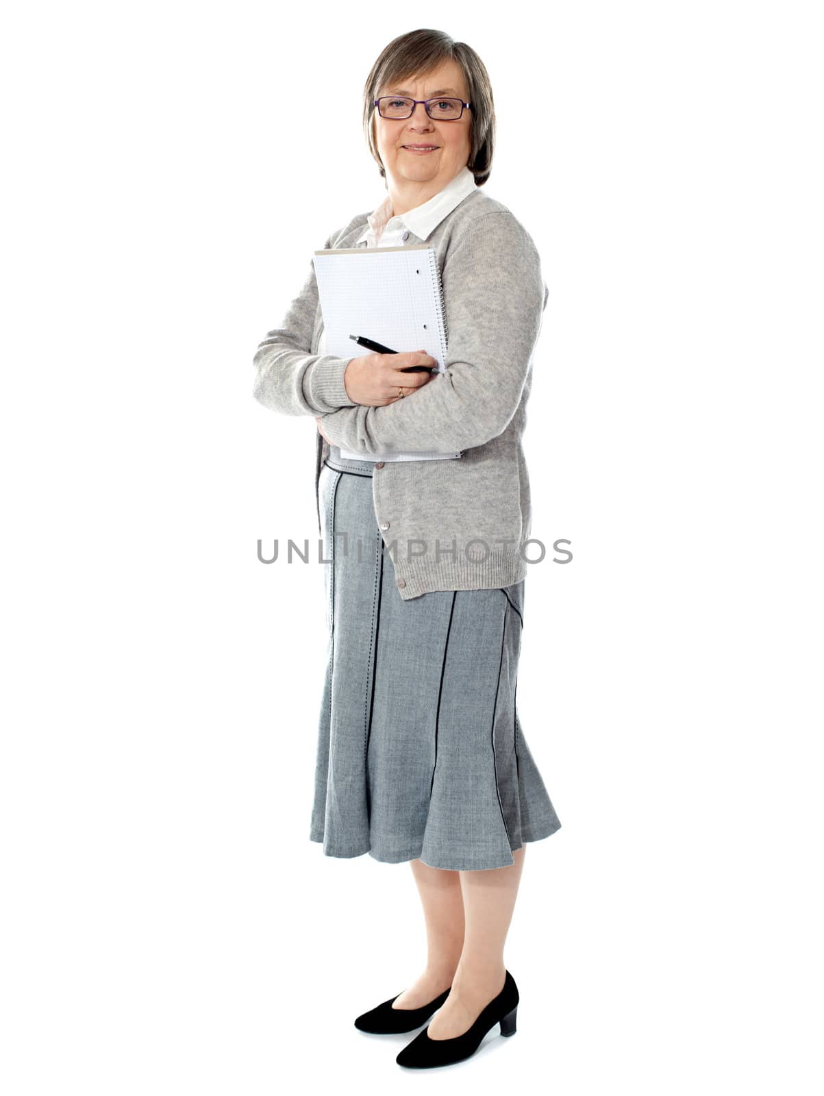 Full length portriat of an aged woman carrying business documents. Isolated on white background