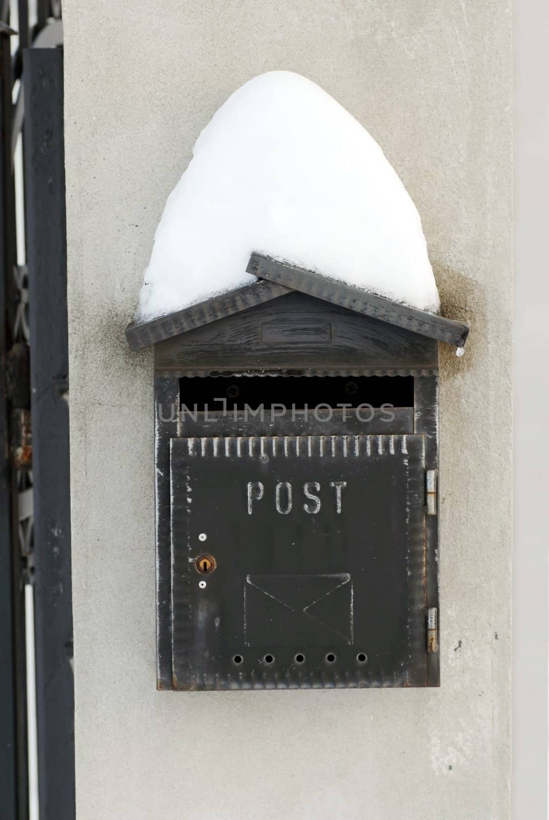 Snow on mail post box by simply