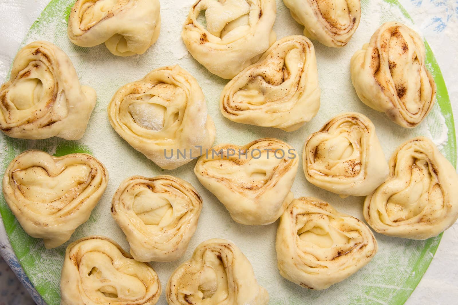 Half-finished product of a roll with cinnamon