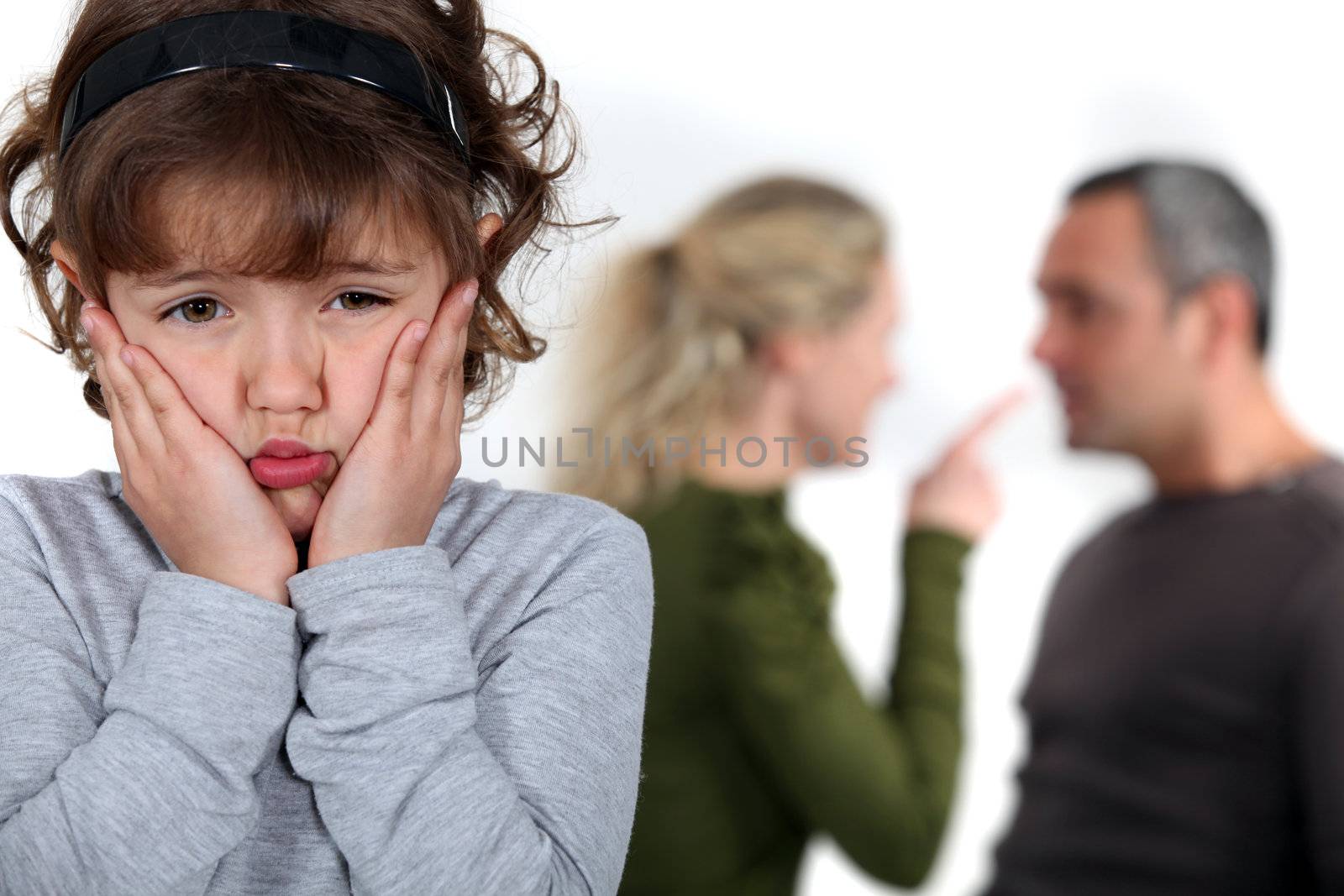 Little girl upset by parents arguing by phovoir