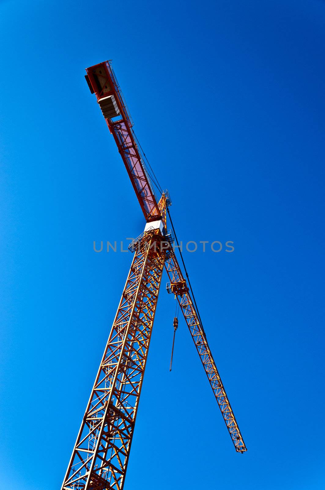 Tower crane on blue background by Nanisimova