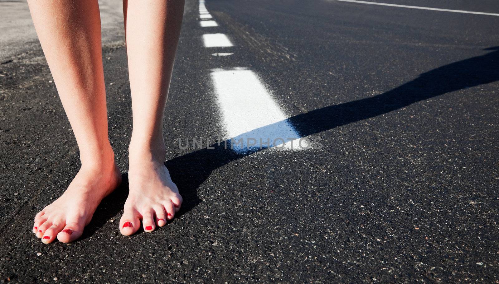 Barefoot girl on the road