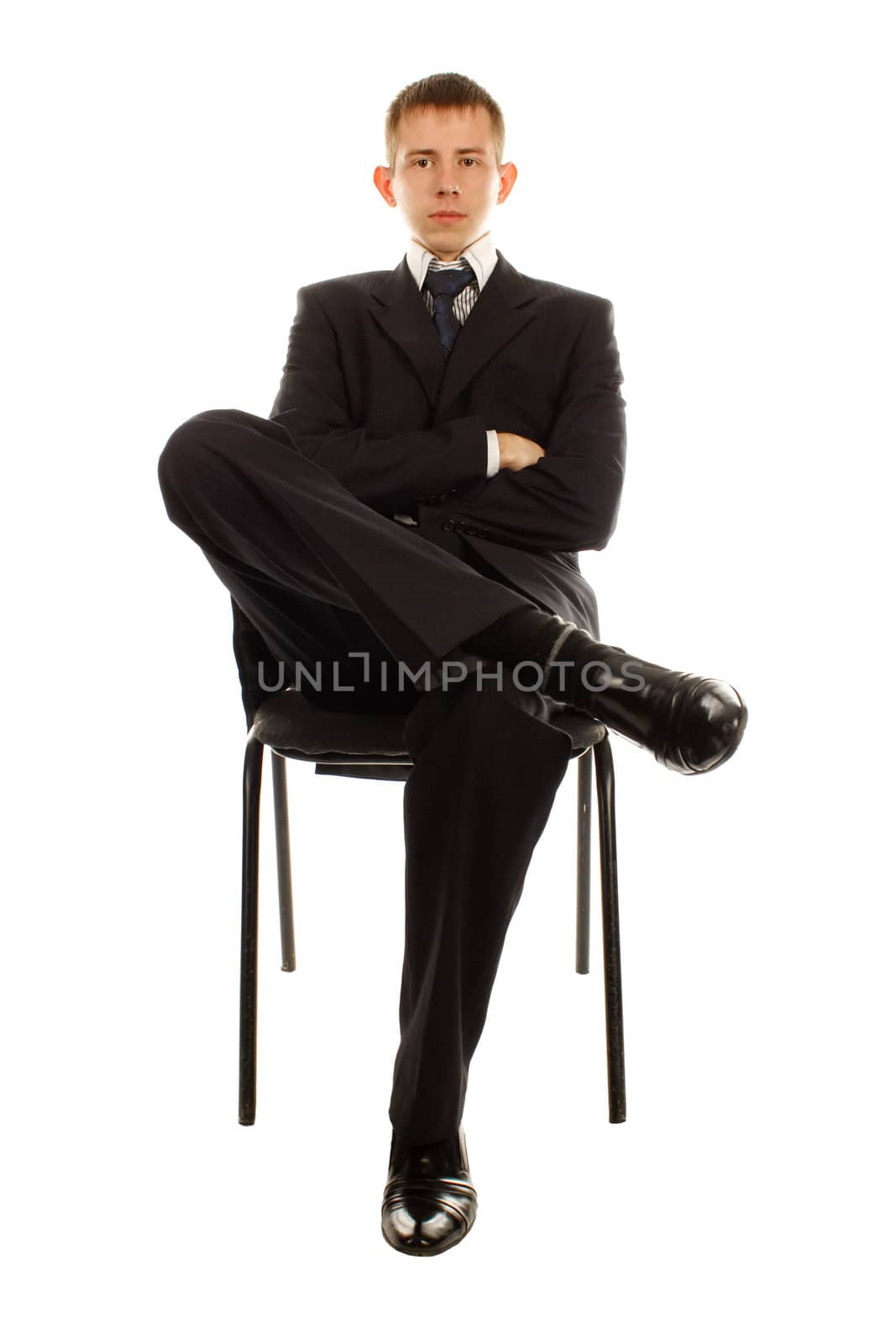 The businessman on the chair isolated on white background.