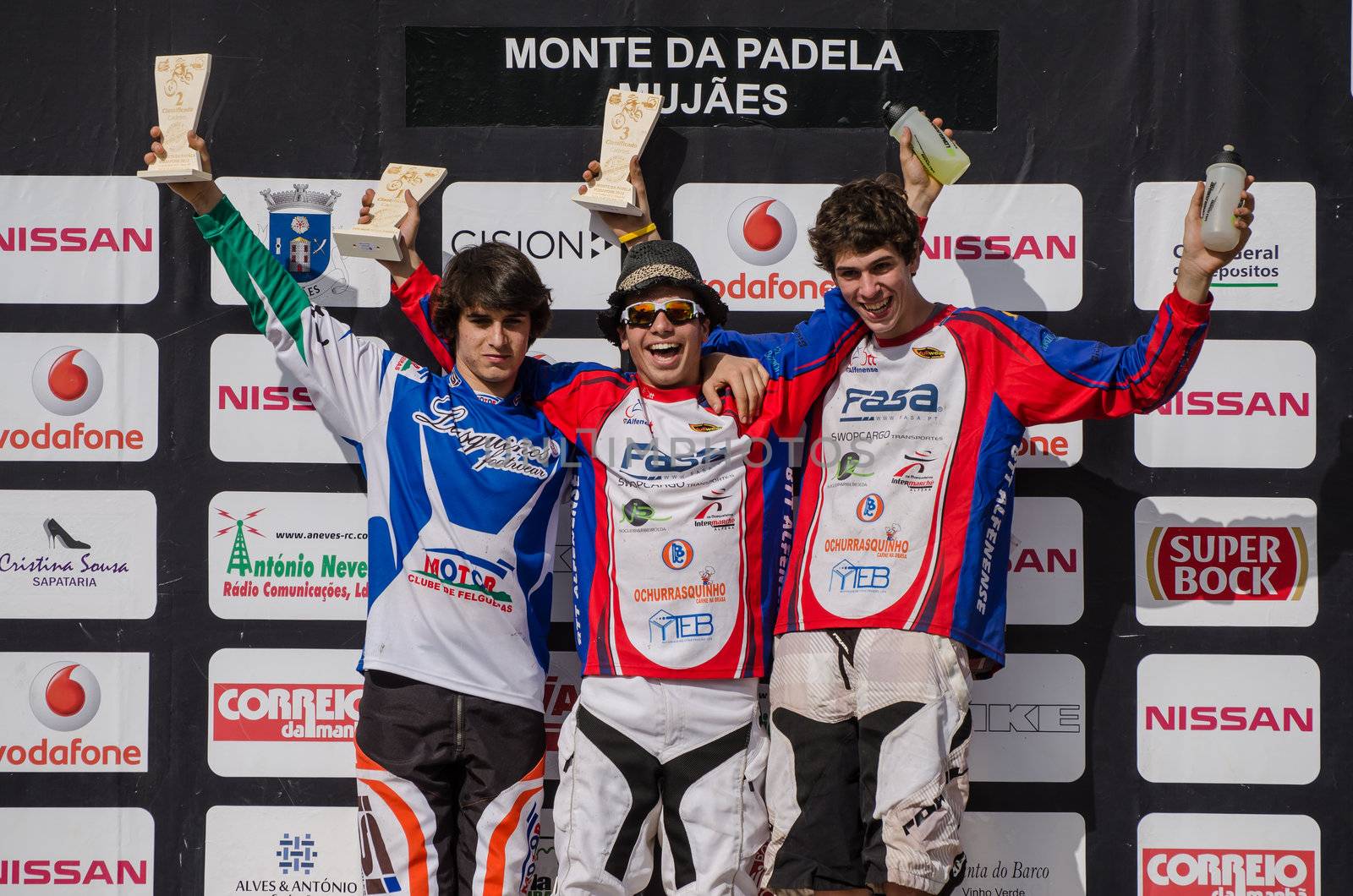 VIANA DO CASTELO, PORTUGAL - MAY 13: Cadet winner Rafael Sousa in the middle at the podium on the 4th Stage of the Taca de Portugal Downhill Vodafone on may 13, 2012 in Viana do Castelo, Portugal.