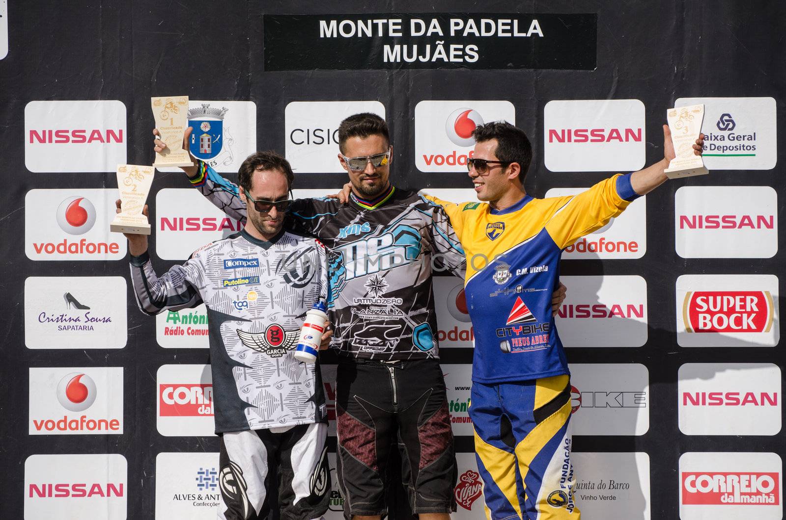 VIANA DO CASTELO, PORTUGAL - MAY 13: Master 30 winner Ruben Carril in the middle at the podium on the 4th Stage of the Taca de Portugal Downhill Vodafone on may 13, 2012 in Viana do Castelo, Portugal.