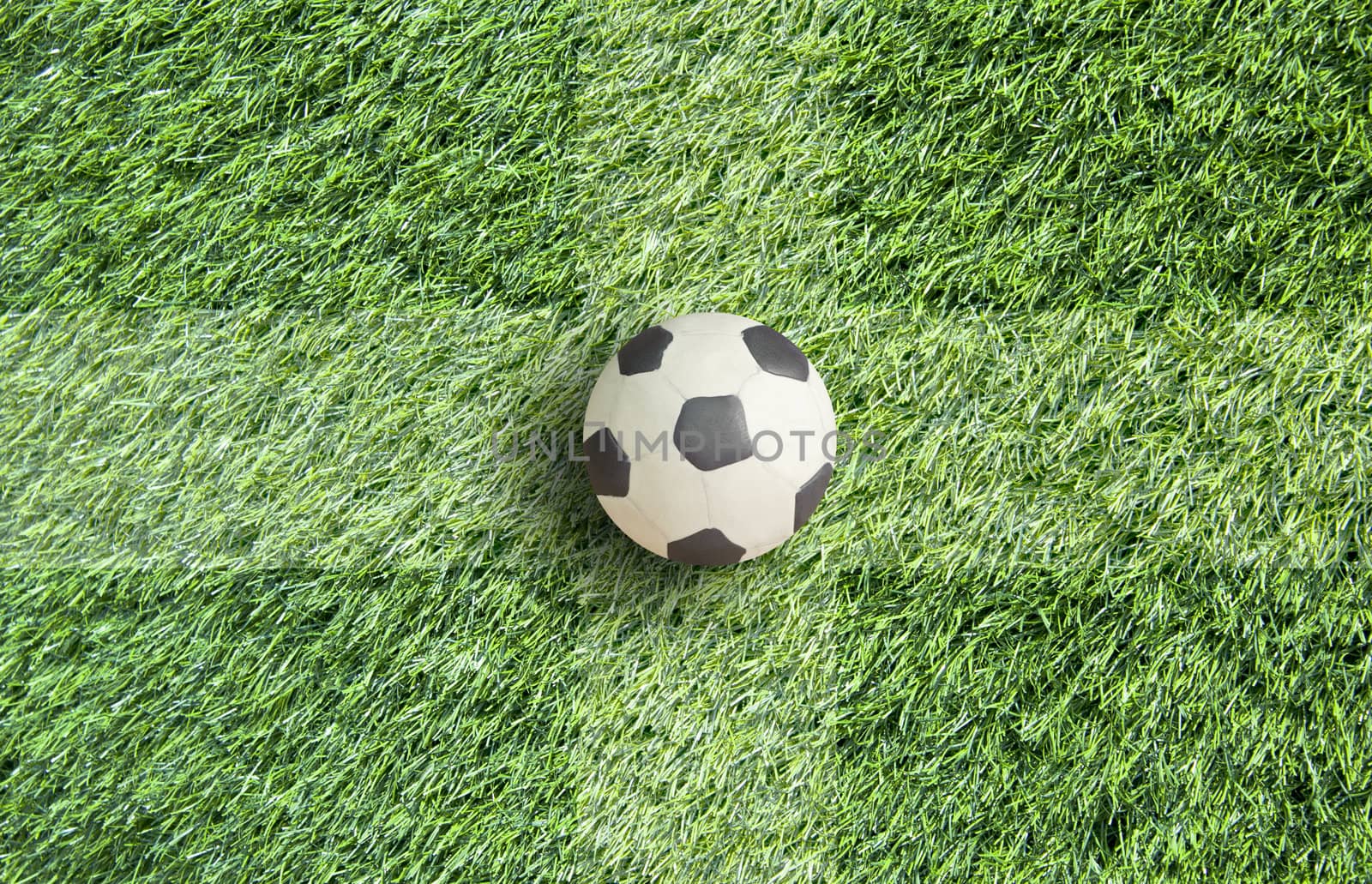 Plasticine Football on grass background 