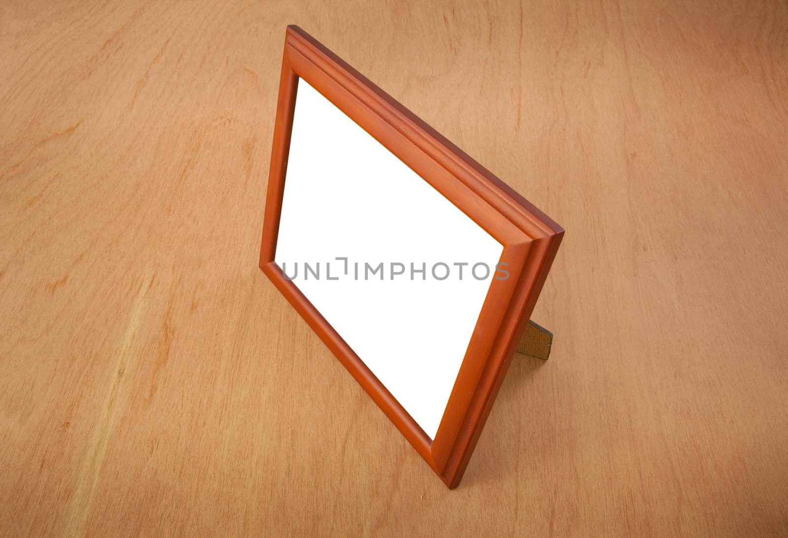 Photo frames on the table wood background