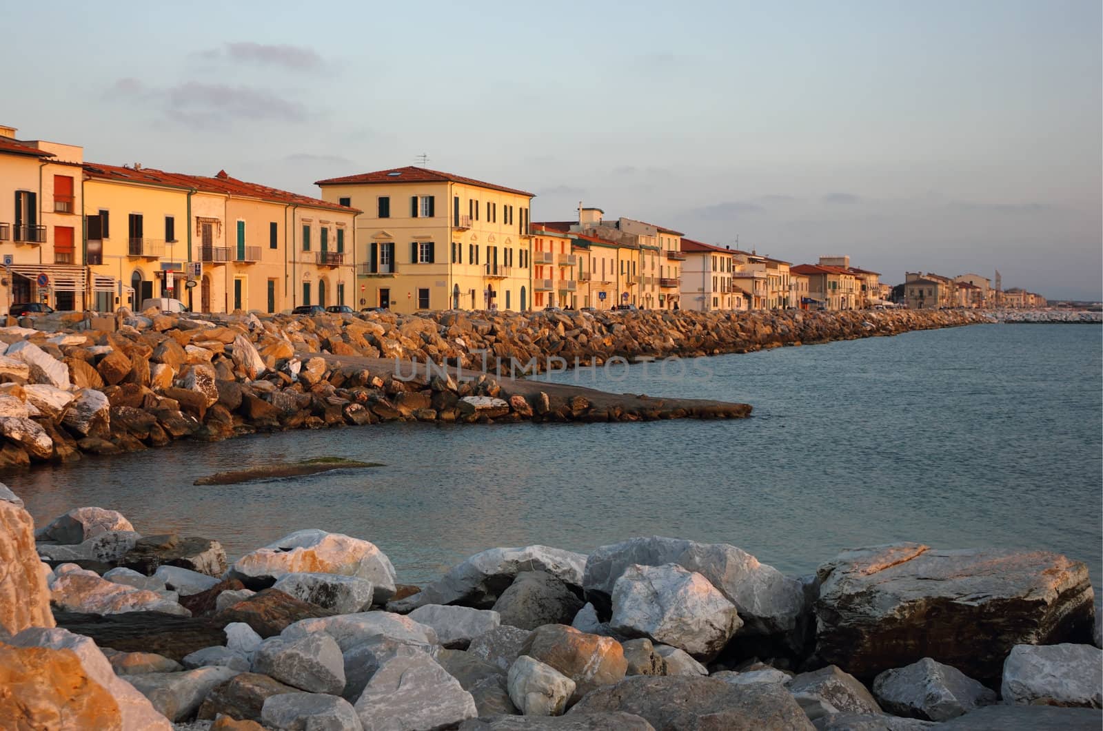 Marina di Pisa sunset view of the town's waterfront street.