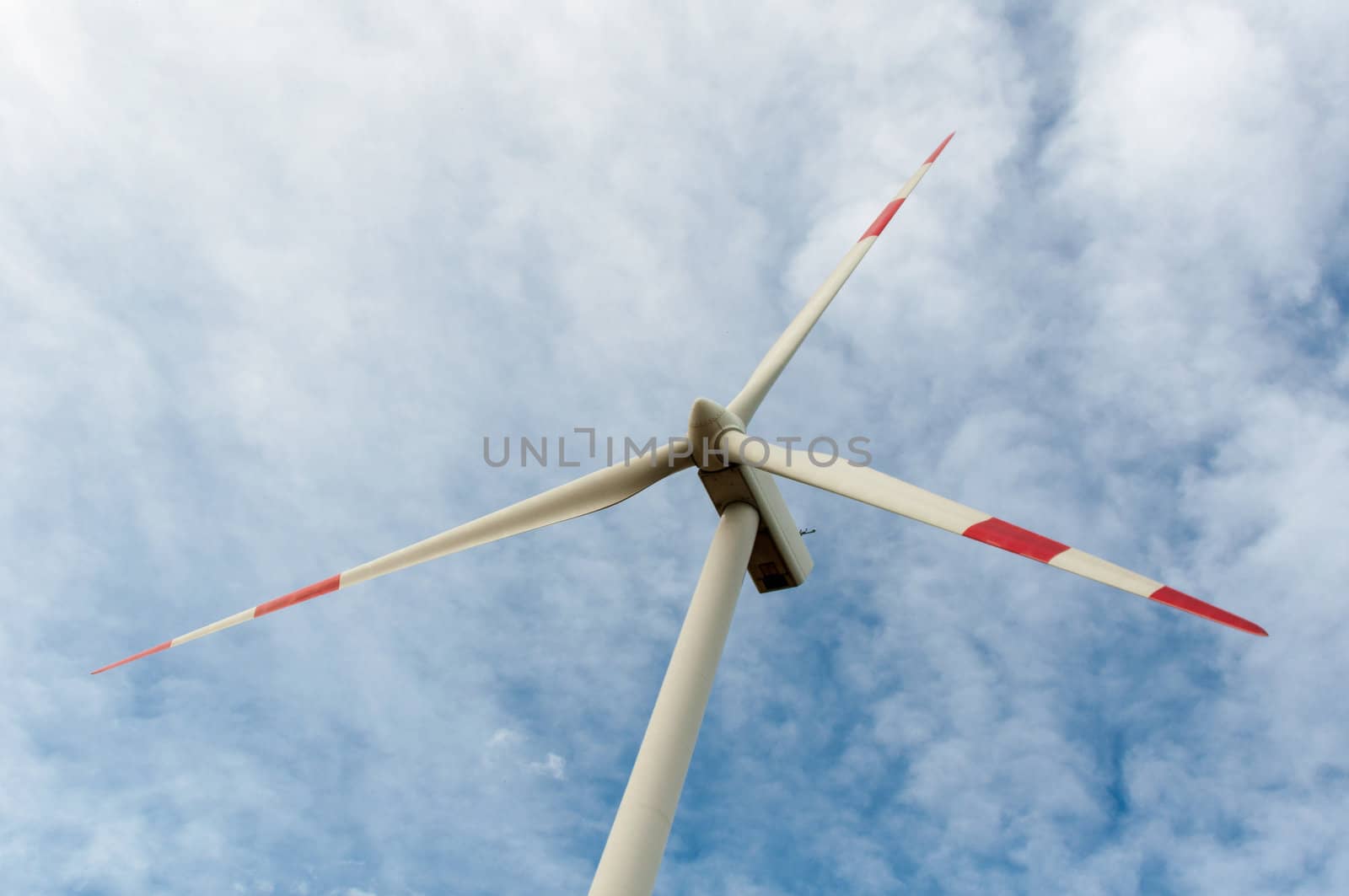 close-up portrait of wind turbine in blue sky