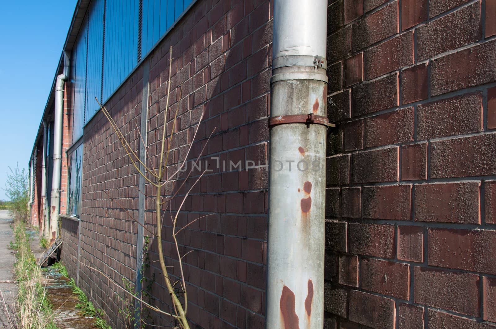detail shot of an abandoned factory with broken windows