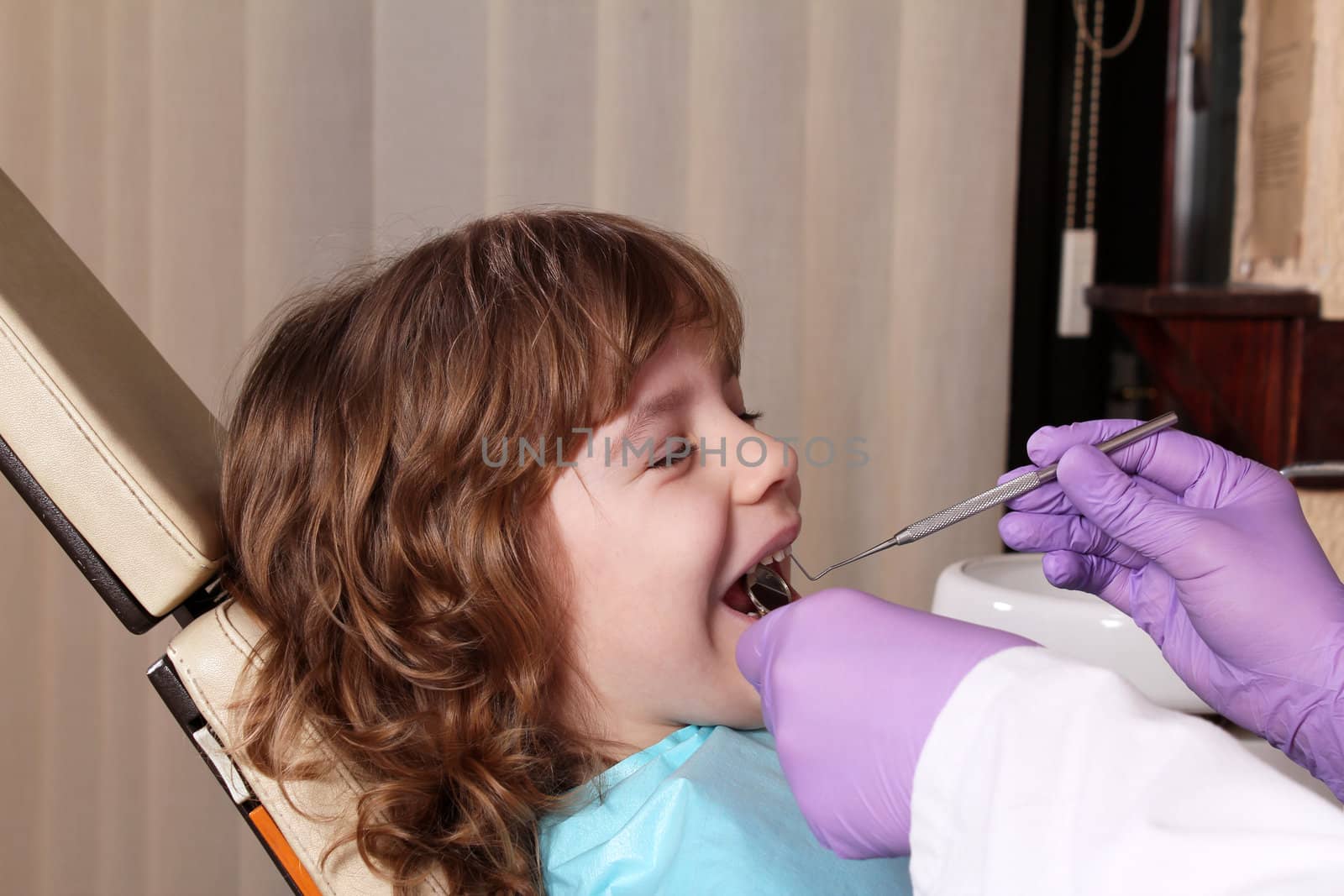 little girl patient dental exam by goce