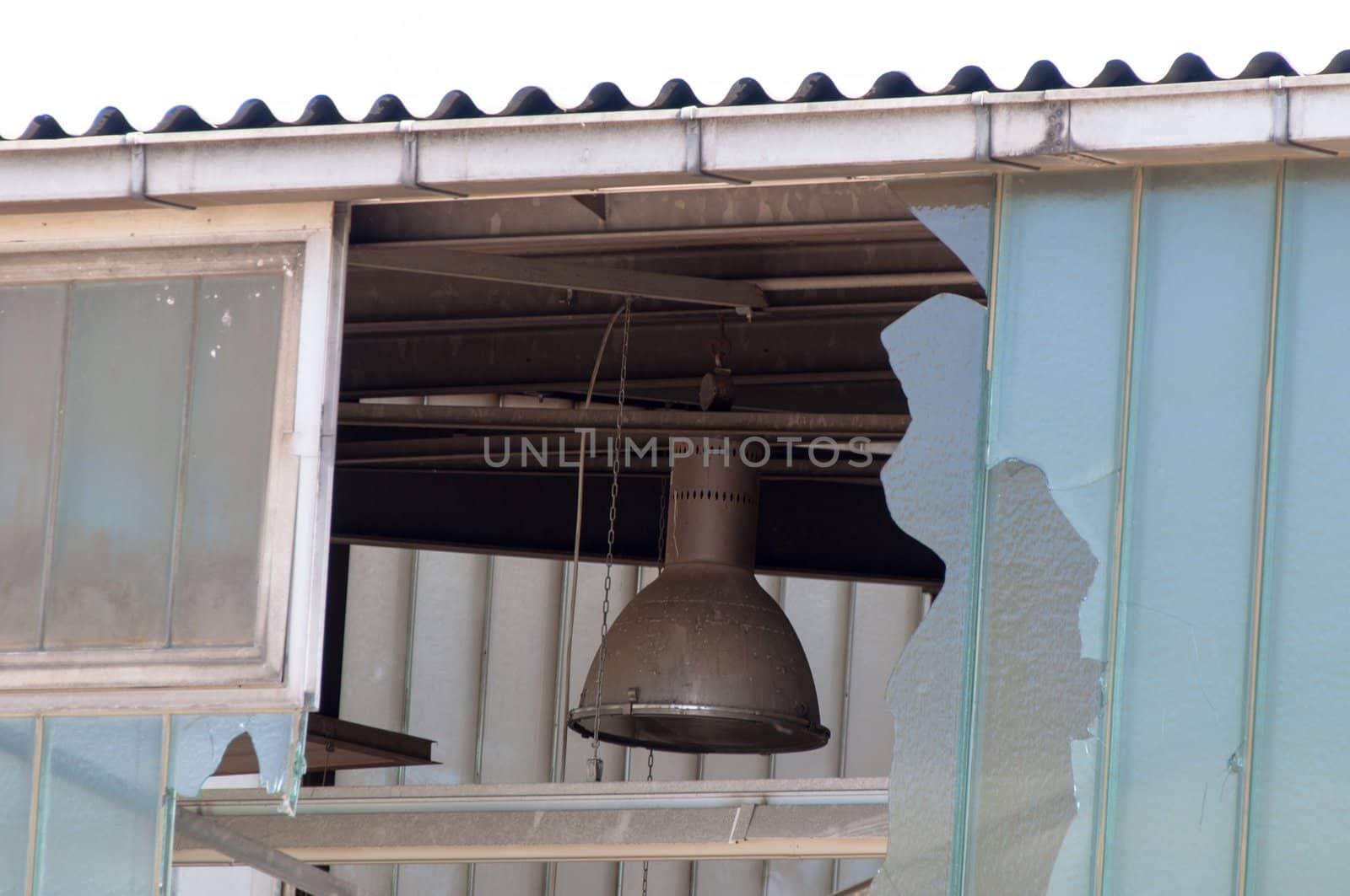 detail shot of an abandoned factory with broken windows