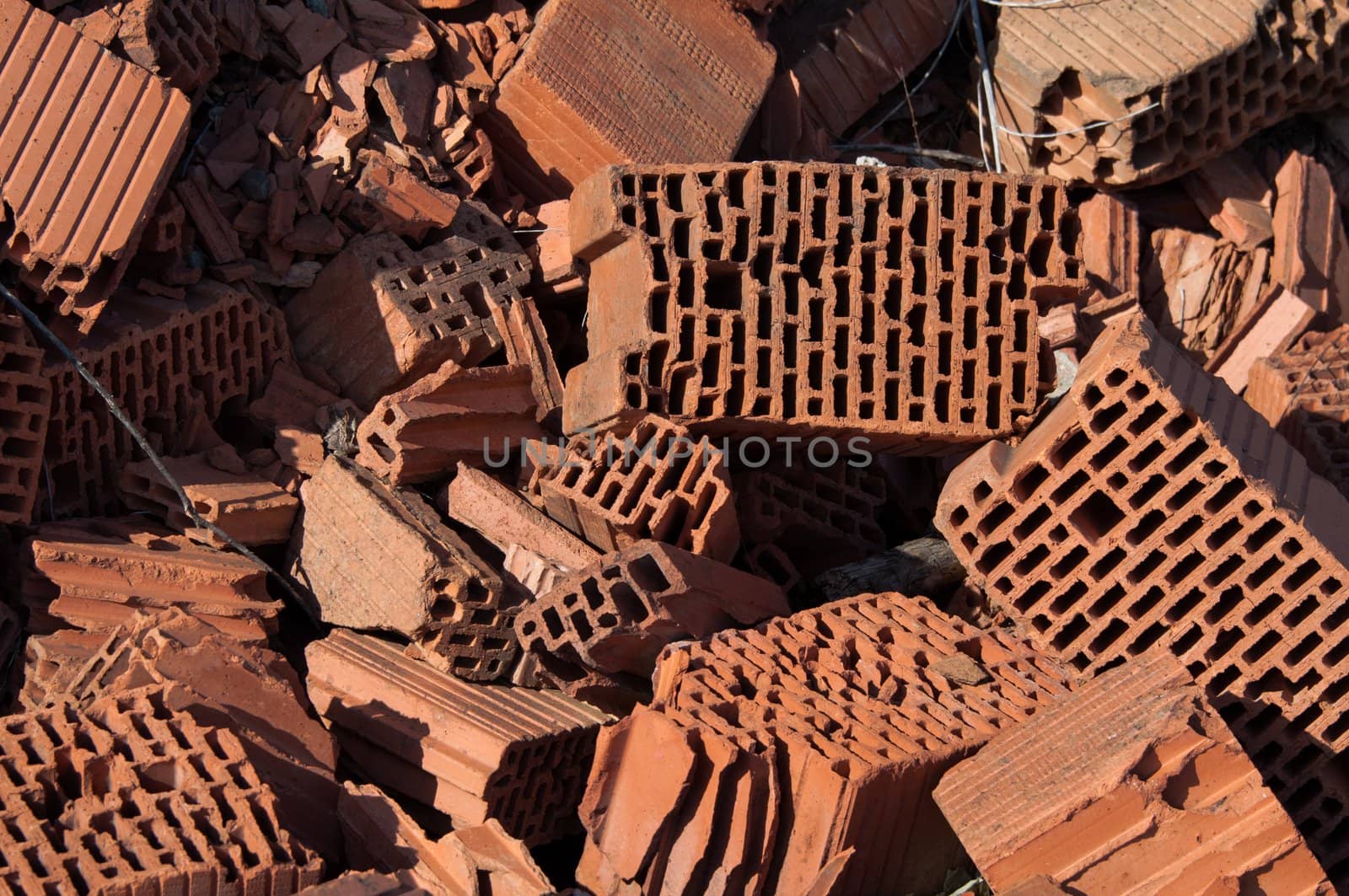 Heap of beaten red brick - grunge background