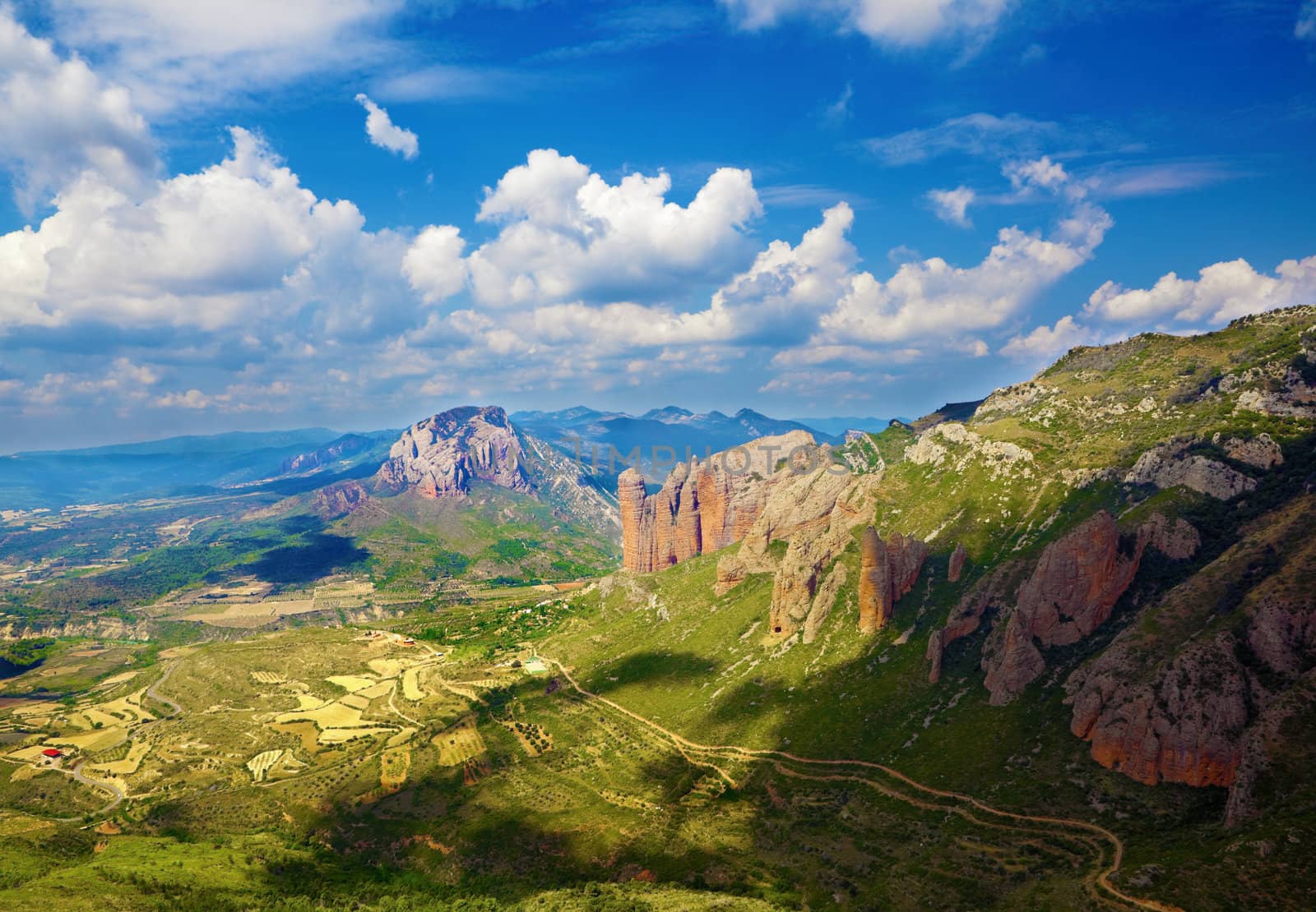 Panoramic image of landscape with mountains,village and sky