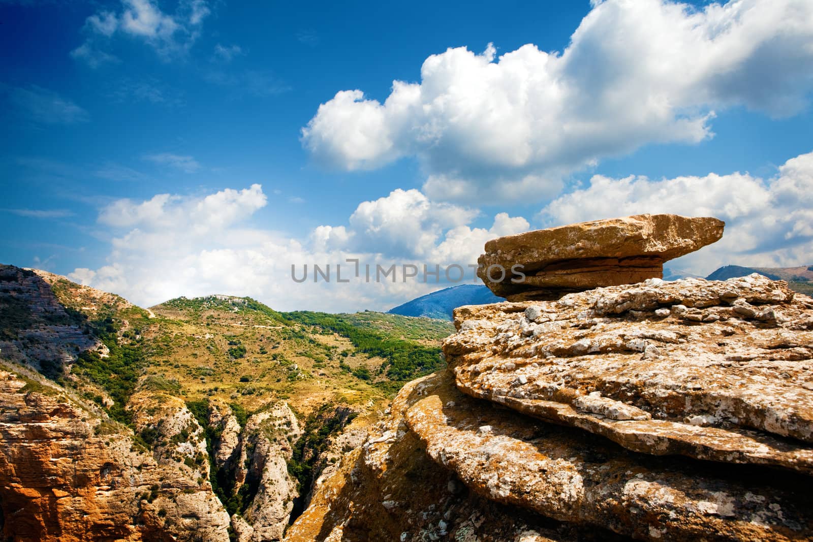 Mountain landscape with a rock on top