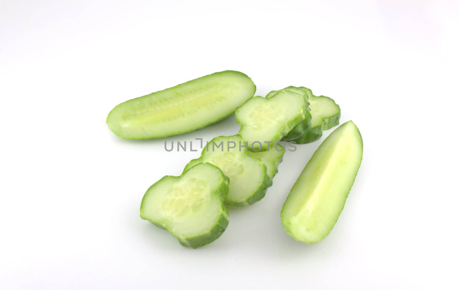 Cutted cucumber over white