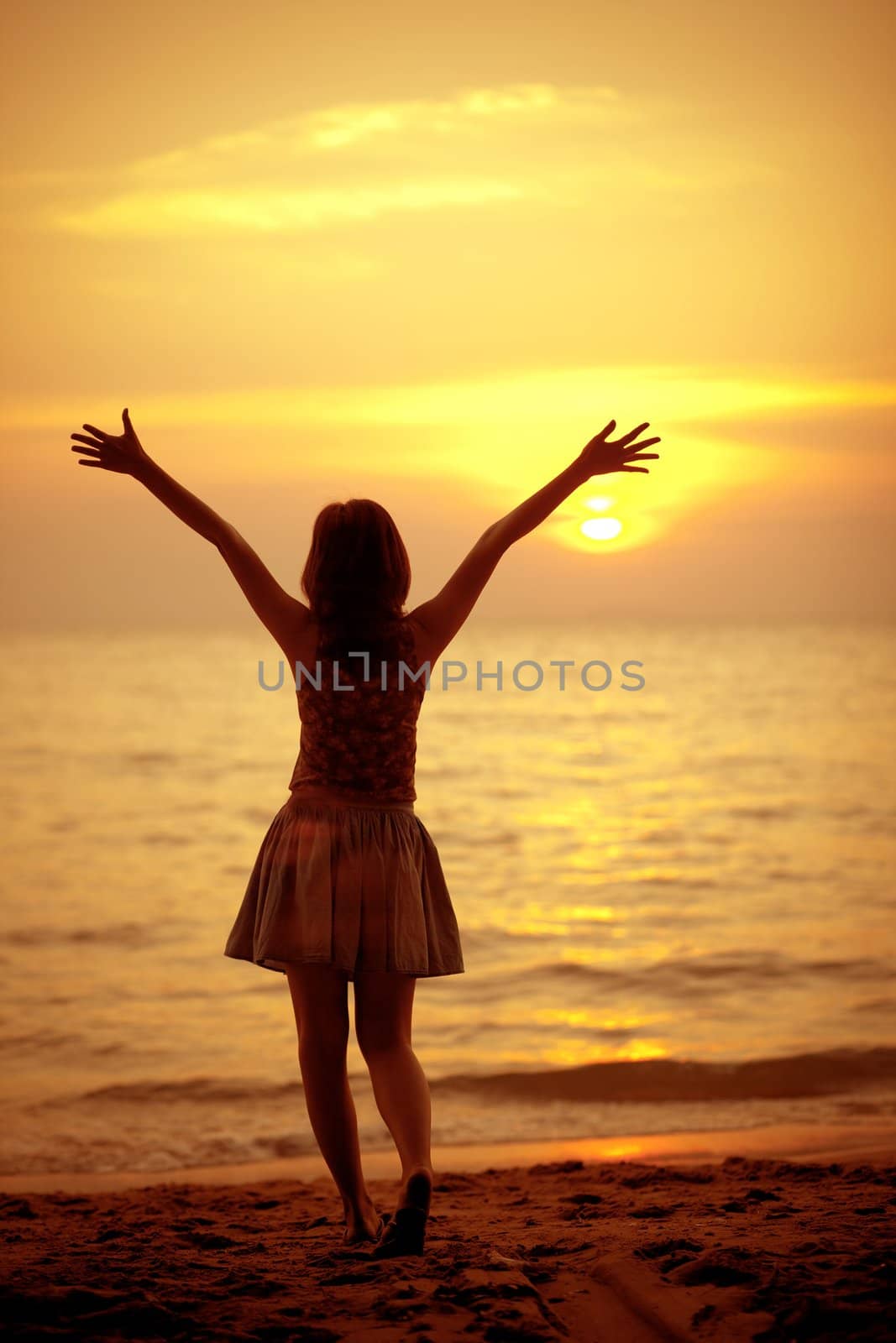 Silhouette of a girl in the beach