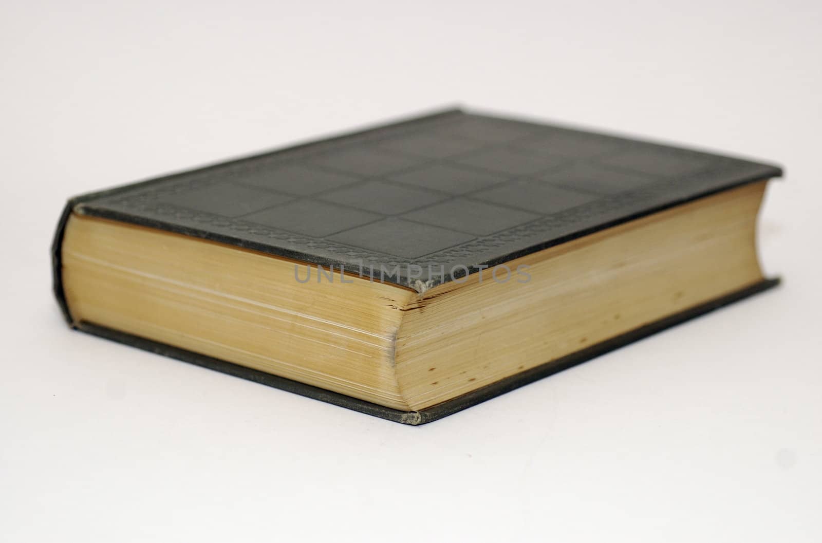 One leather bound, old fashioned book against a white background and copy space