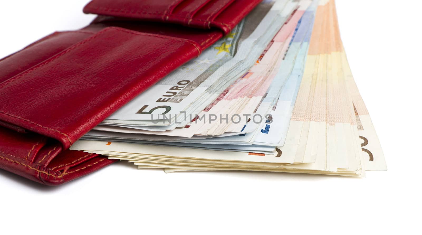 many banknotes in red wallet isolated on white background