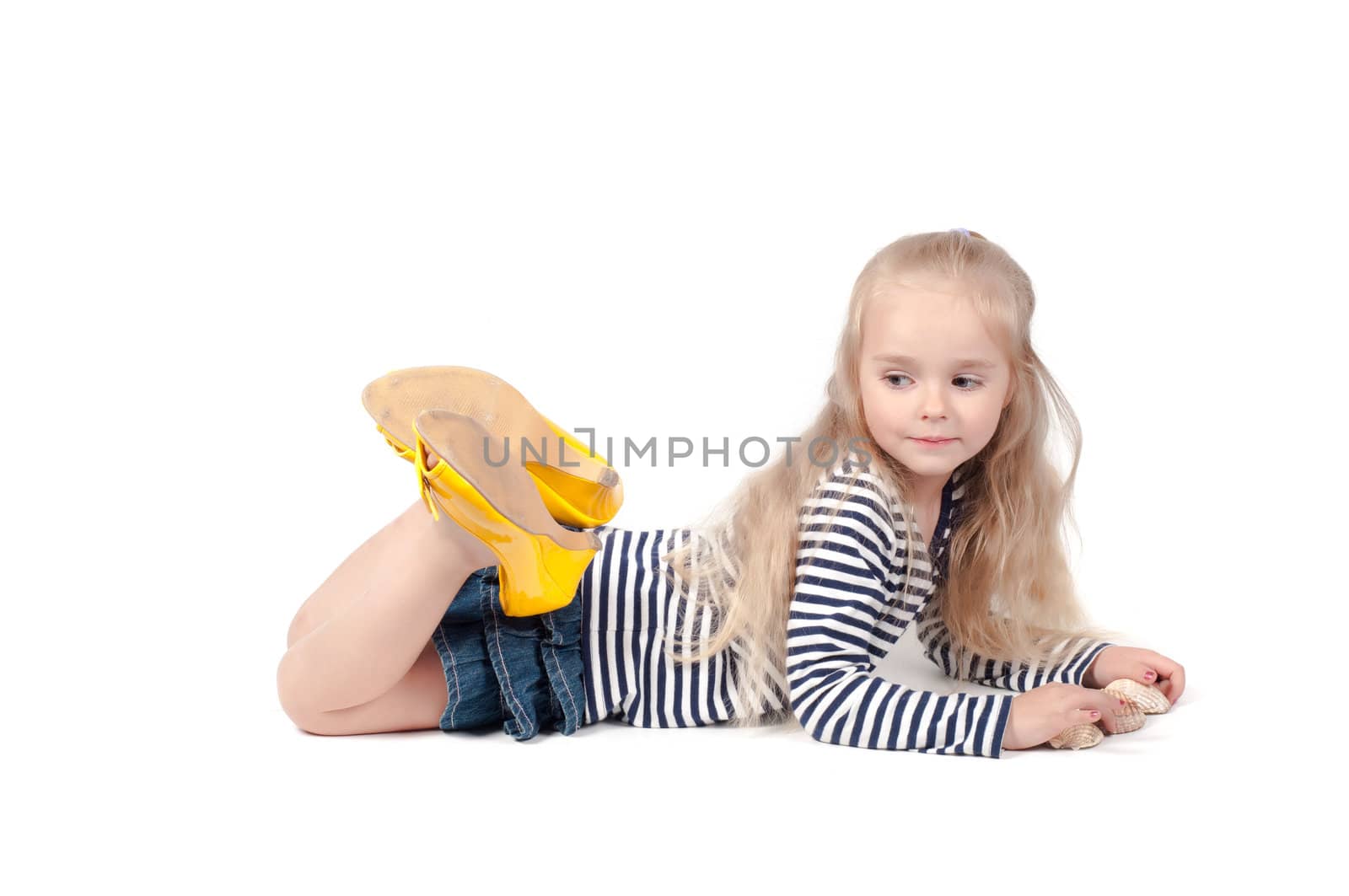 Shot of little cute with mother shoes in studio lies