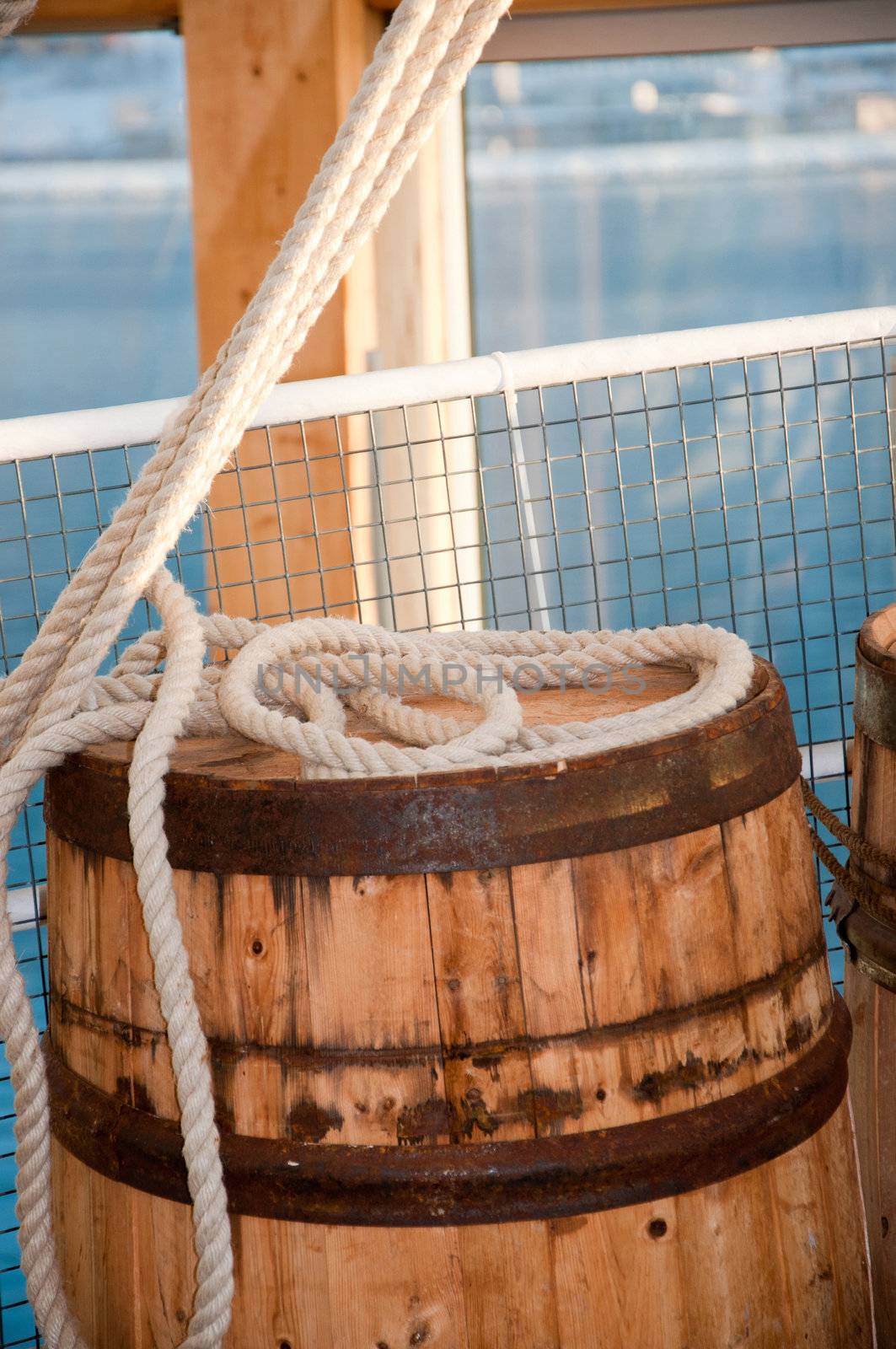Barrel and rope on sea background by Nanisimova
