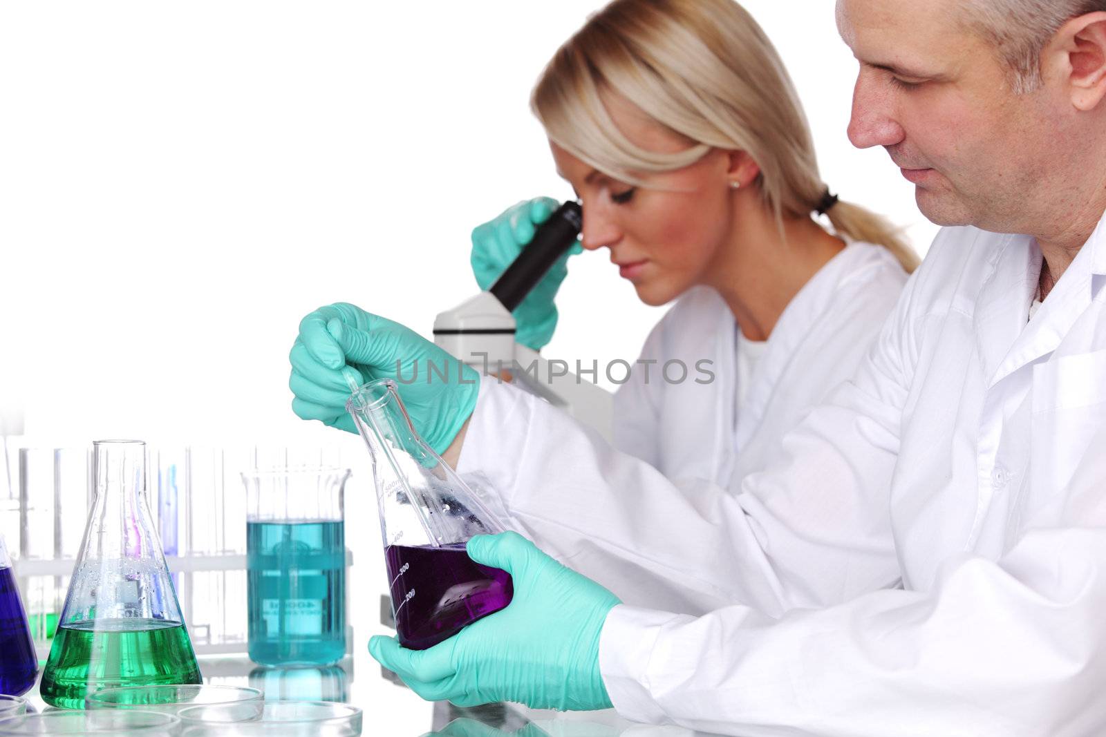 two scientist in chemical lab conducting experiments
