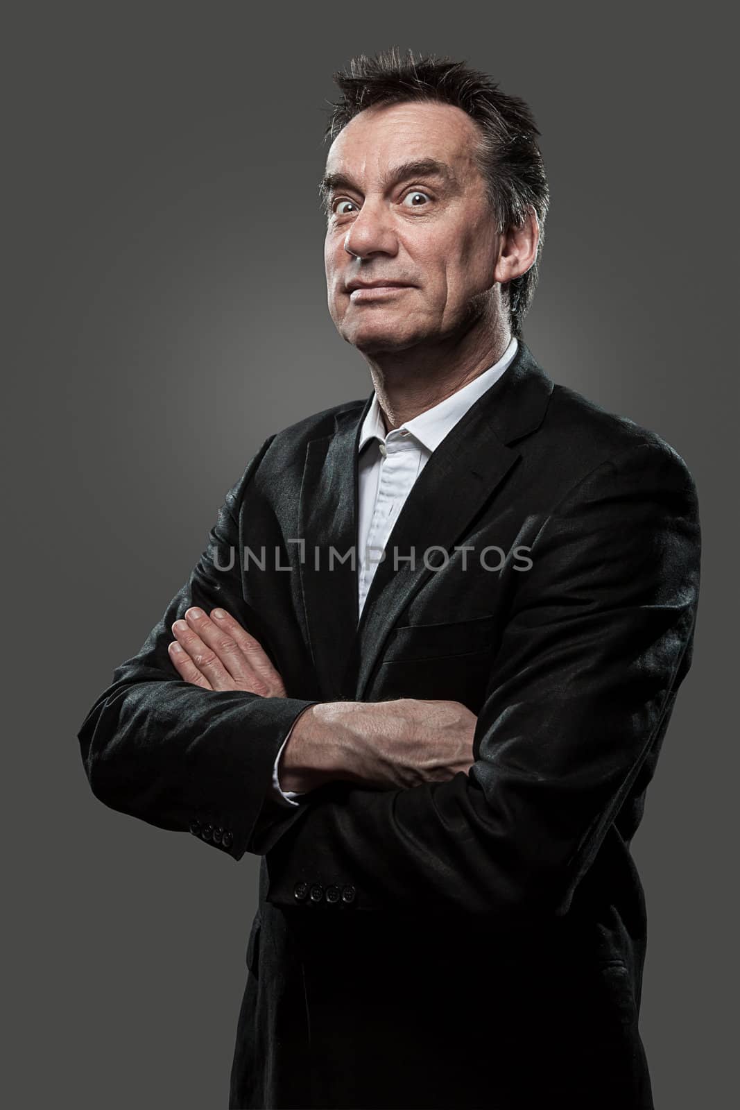 Handsome Middle Age Business Arms Folded Pulling Face Grey Background Grunge Look