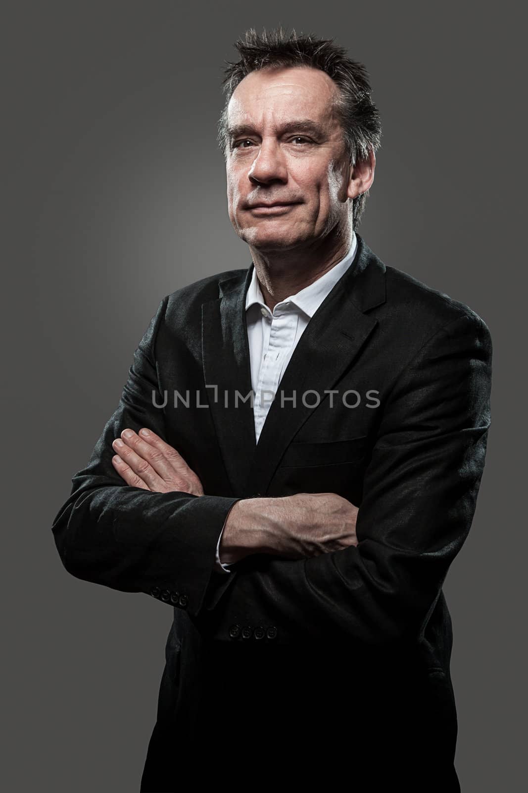 Handsome Smiling Middle Age Business Man Arms Folded Grey Background Grunge Look