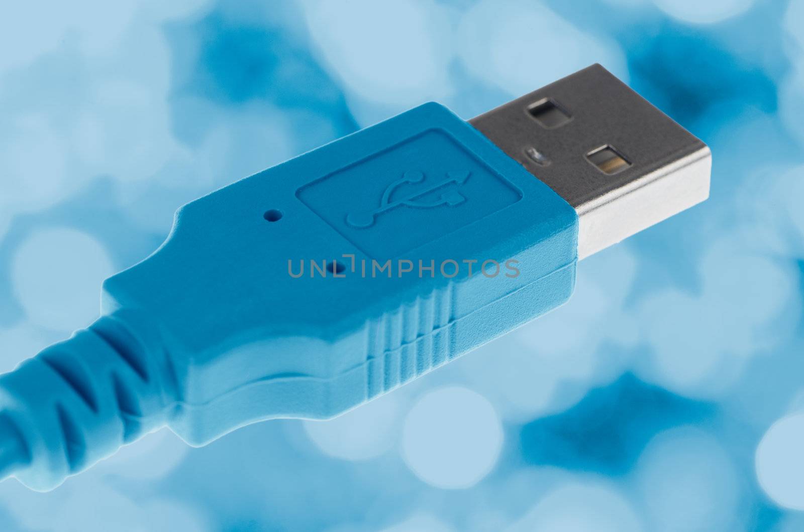 Blue Computer USB cable on blue background.