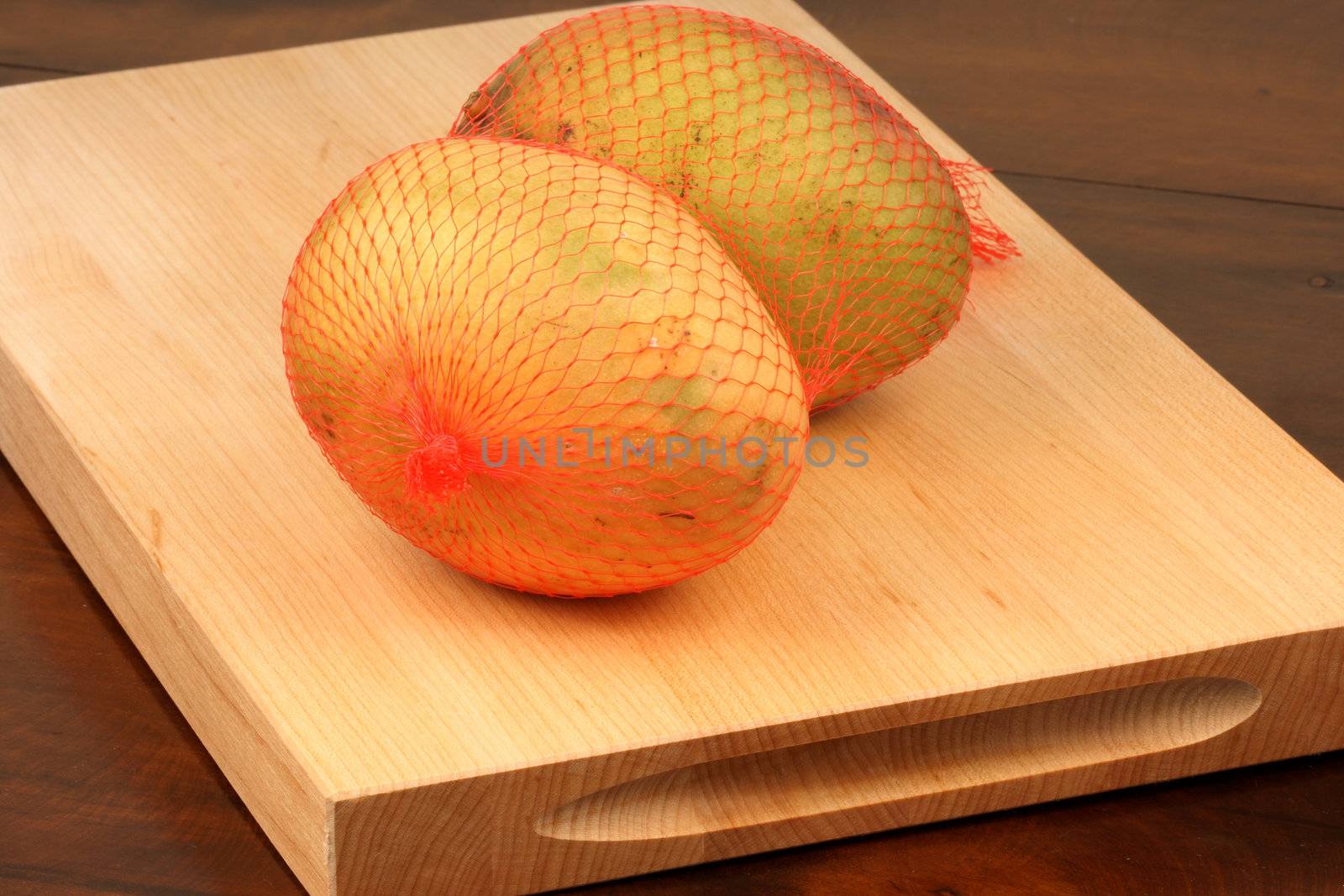 delicious organic mango on wood cutting board  sweet tropical fruit 