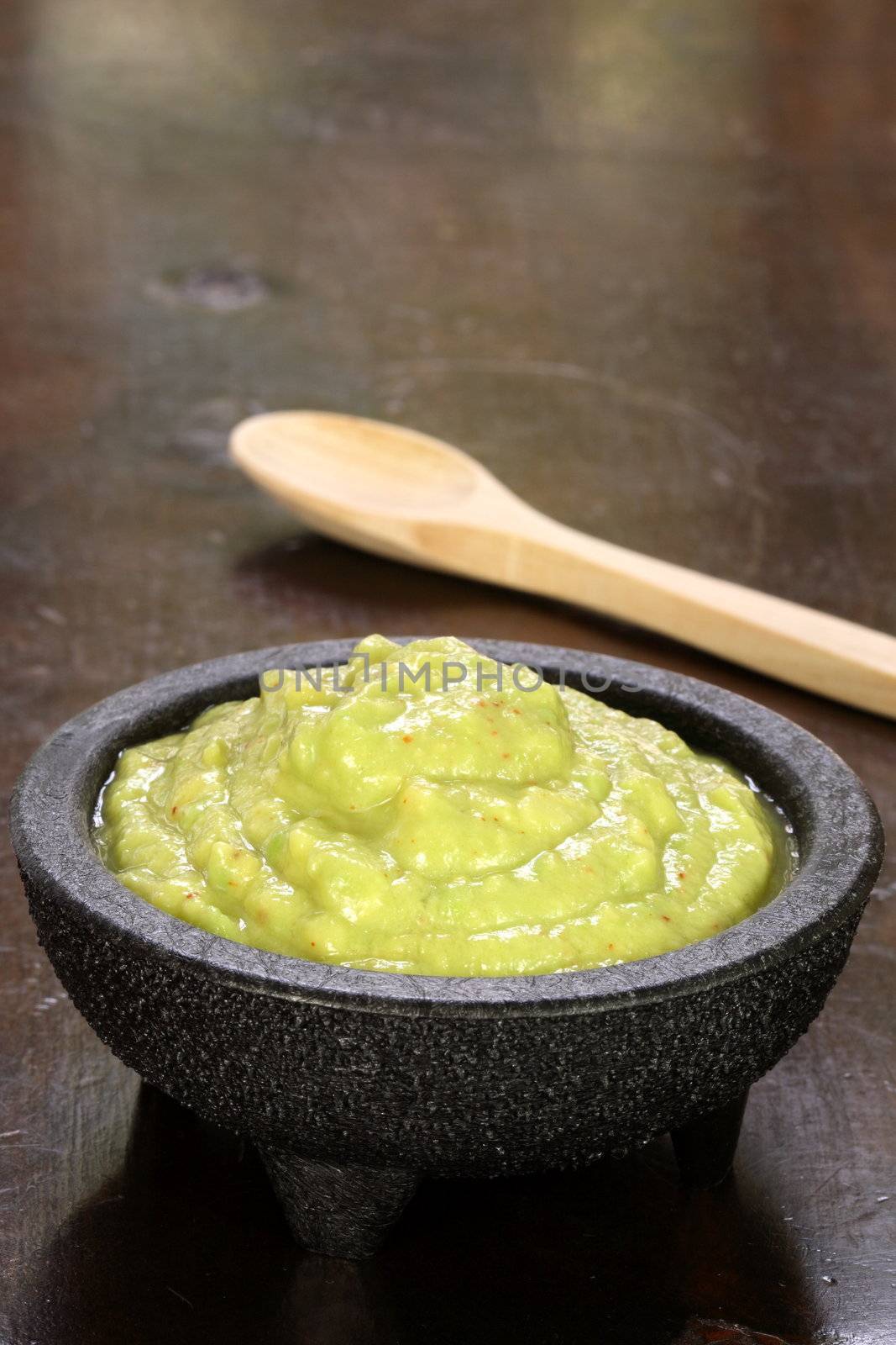 perfectly made mexican guacamole,prepared with fresh avocados lemo juice vinegar and hot and sweet peppers   