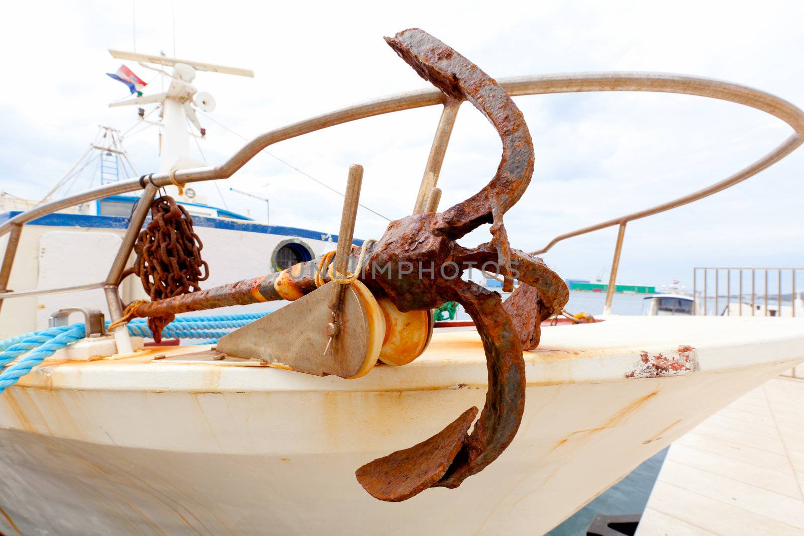 Closeup of old metal anchor on fishing boat