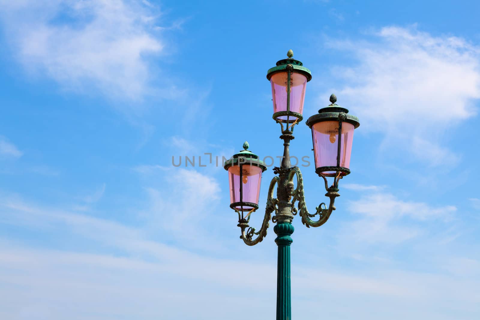 old street-lamp on blue sky