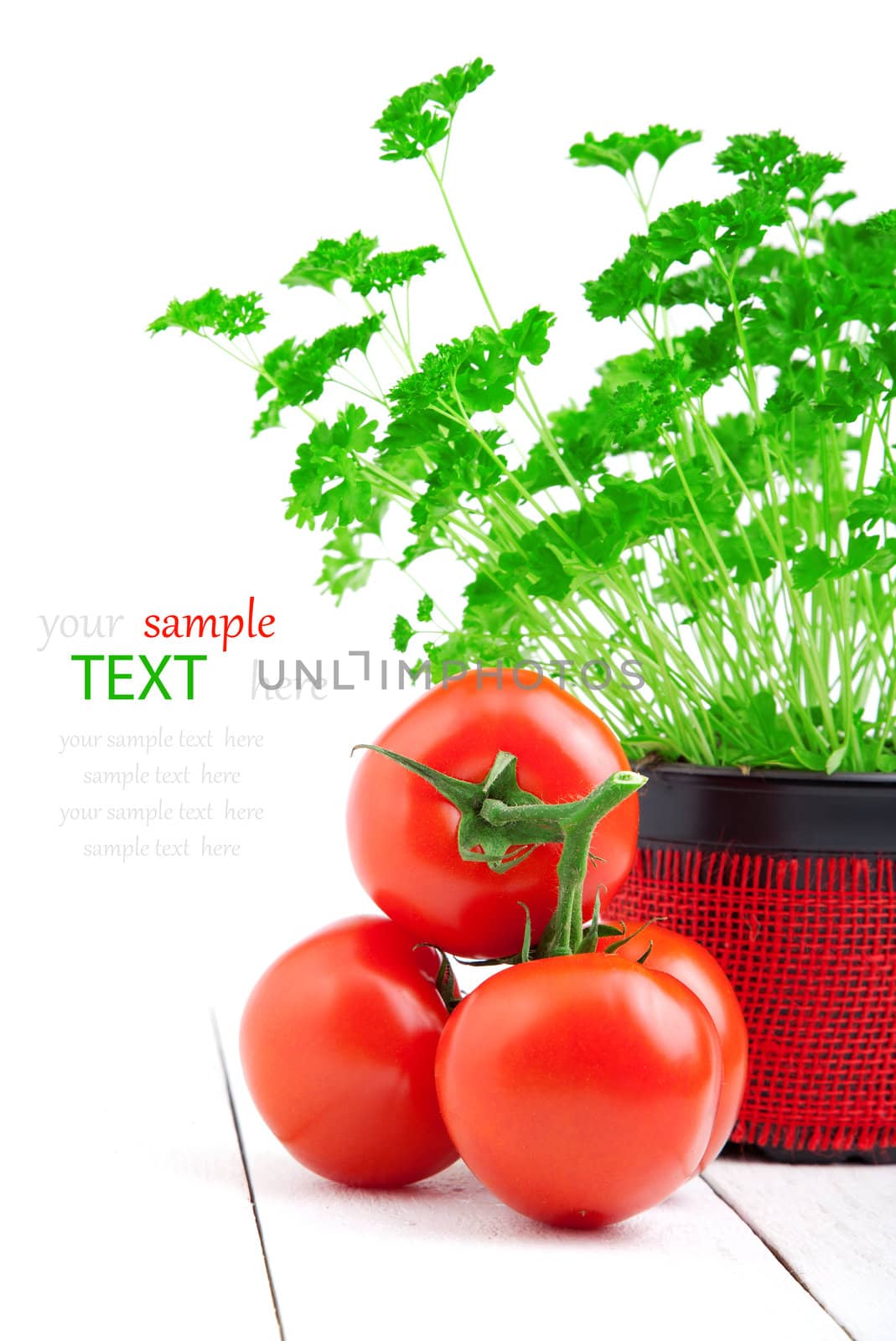 Red tomato with parsley isolated on white background. by motorolka