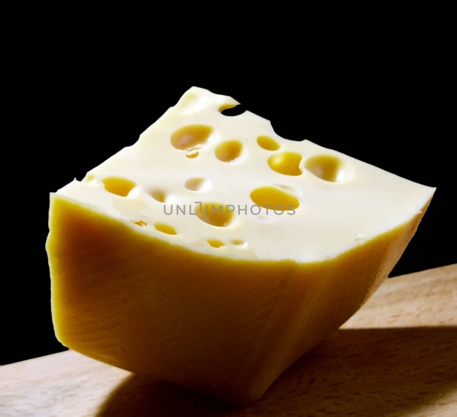 piece of cheese on cutting board