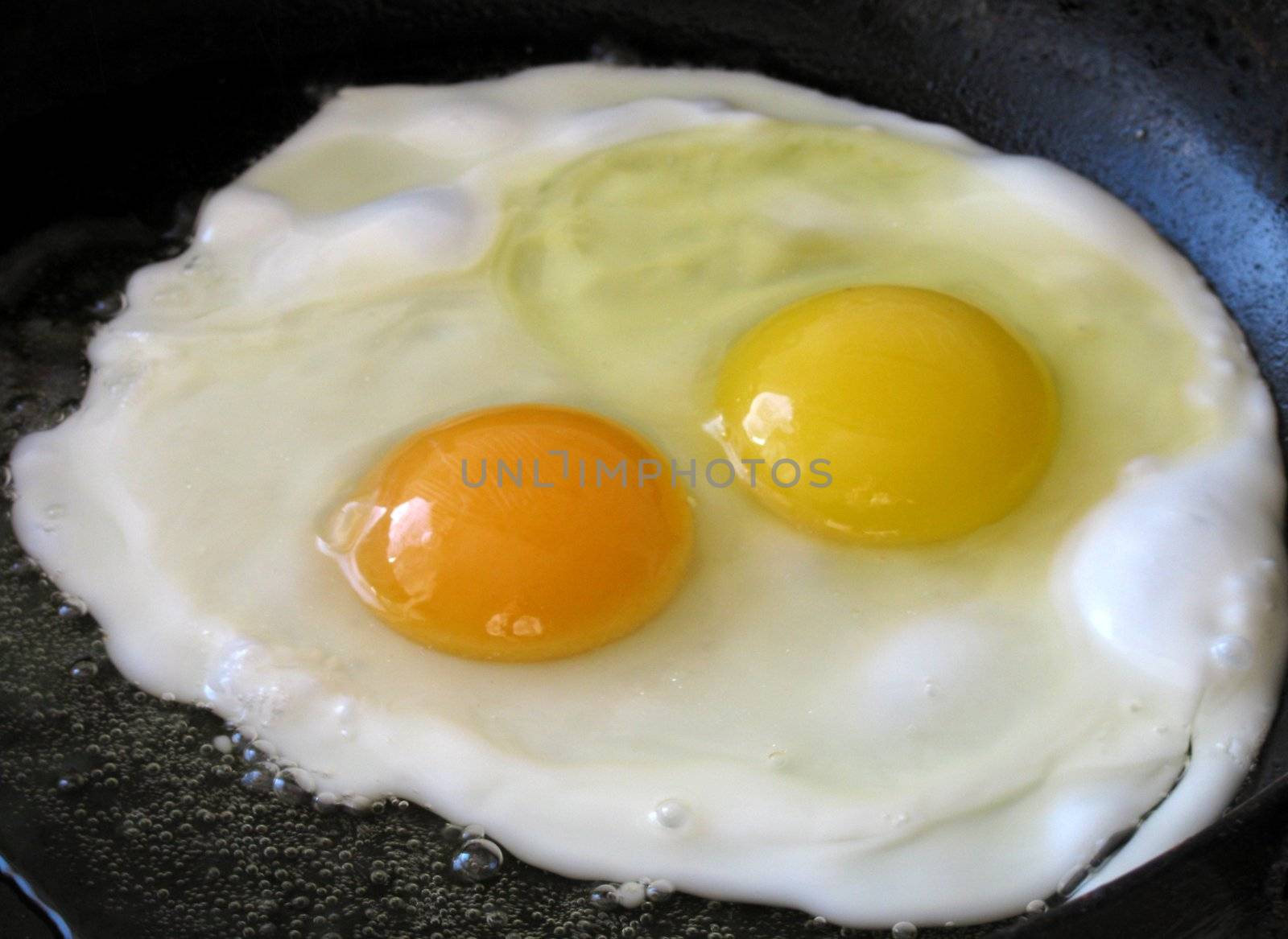 frying eggs on frying pan