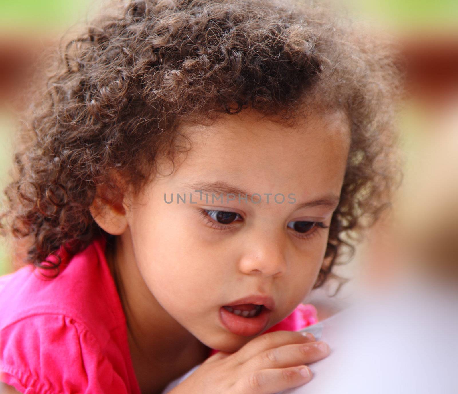 multi racial little girl with surprised expression