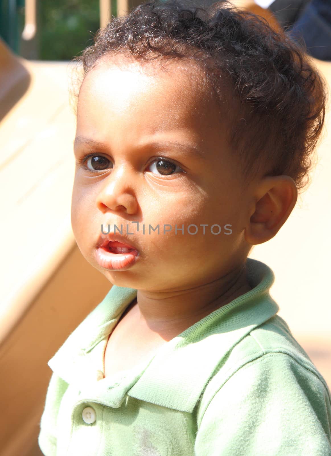 cute mixed race boy with a puzzled look