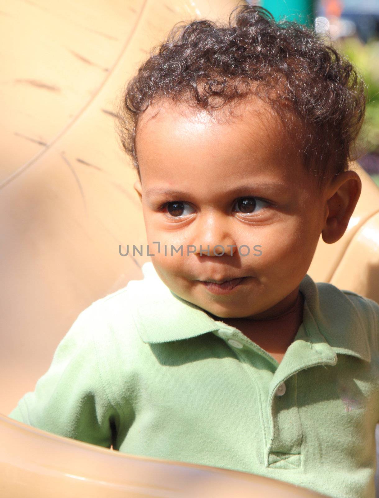 cute mixed race boy in playground