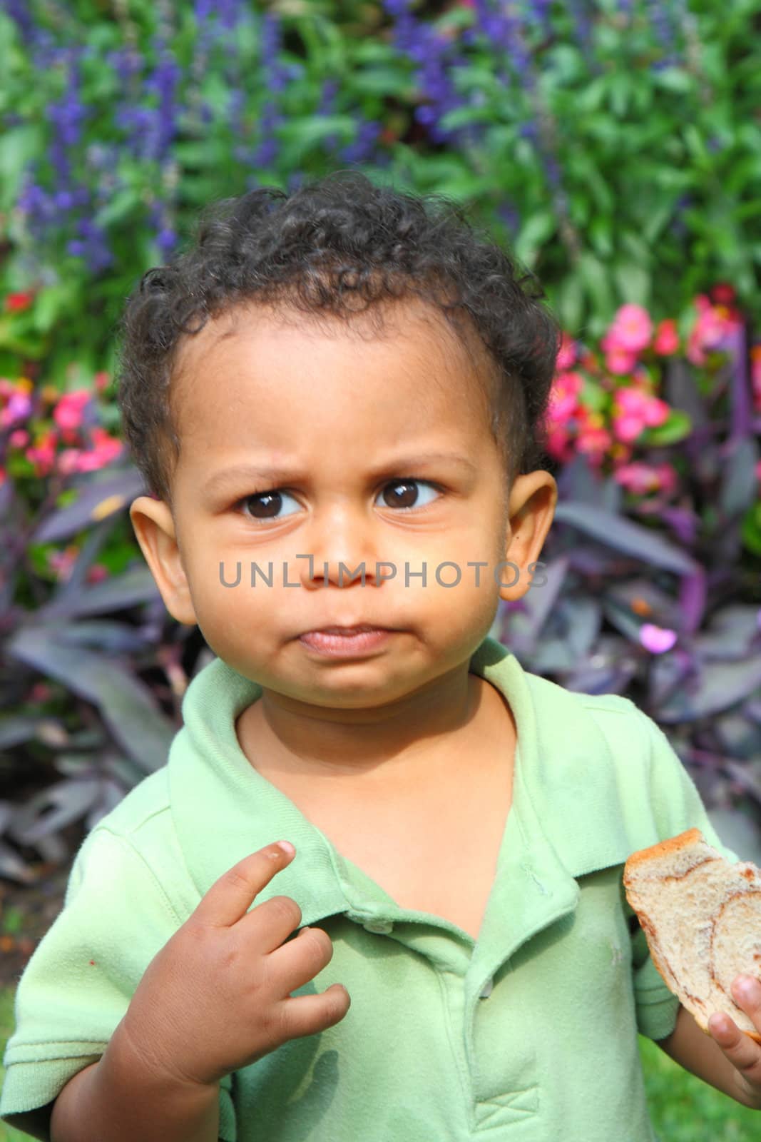 cute mixed race boy with a puzzled look 