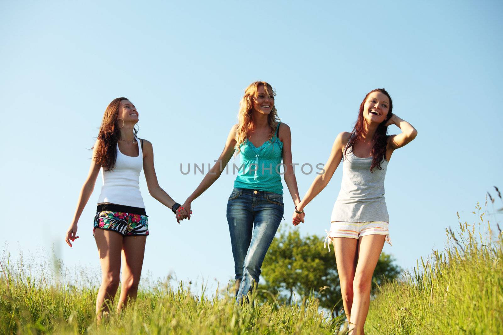 fun smile girlfriends run by green field sun is shine