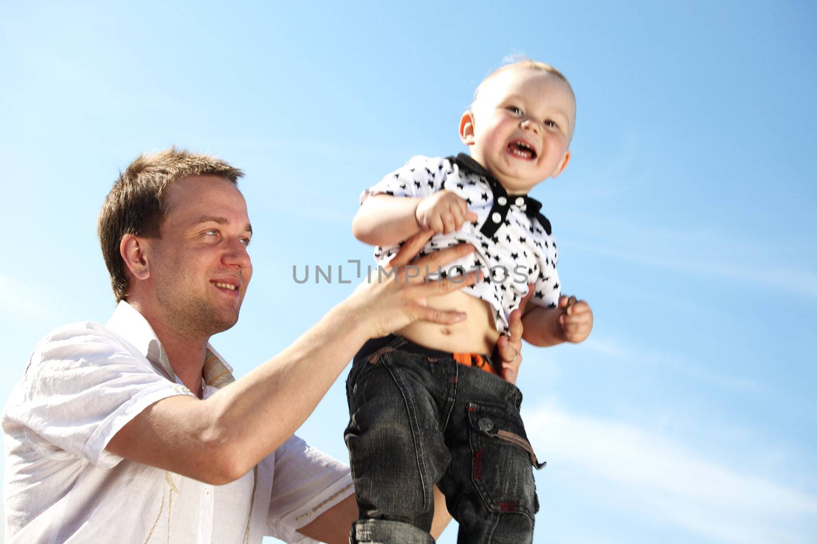 father and take son in blue sky