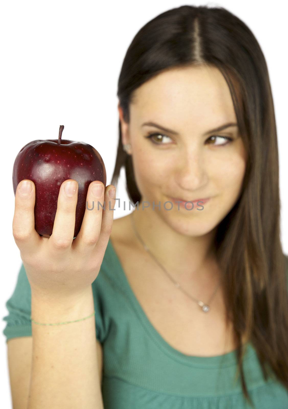 Focus on red big apple out of focus on girl hungry wanting to eat it