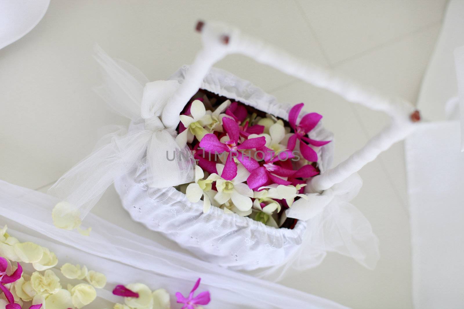 Basket of flowers at a wedding ceremony.